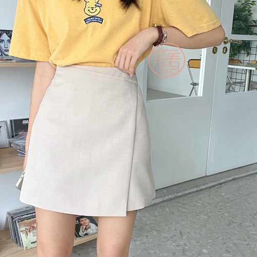 奈看服飾/ 不挑人穿! 不規則斜邊設計質感西裝面料A字裙 隱形拉鏈高腰半身裙 休閒百搭米杏/黑色