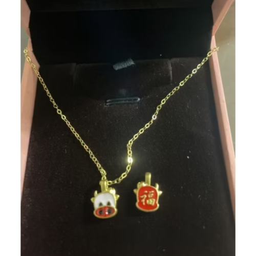 黃金小萌牛墜飾約0.04錢附保單贈鍍金項鍊（傑克商店）